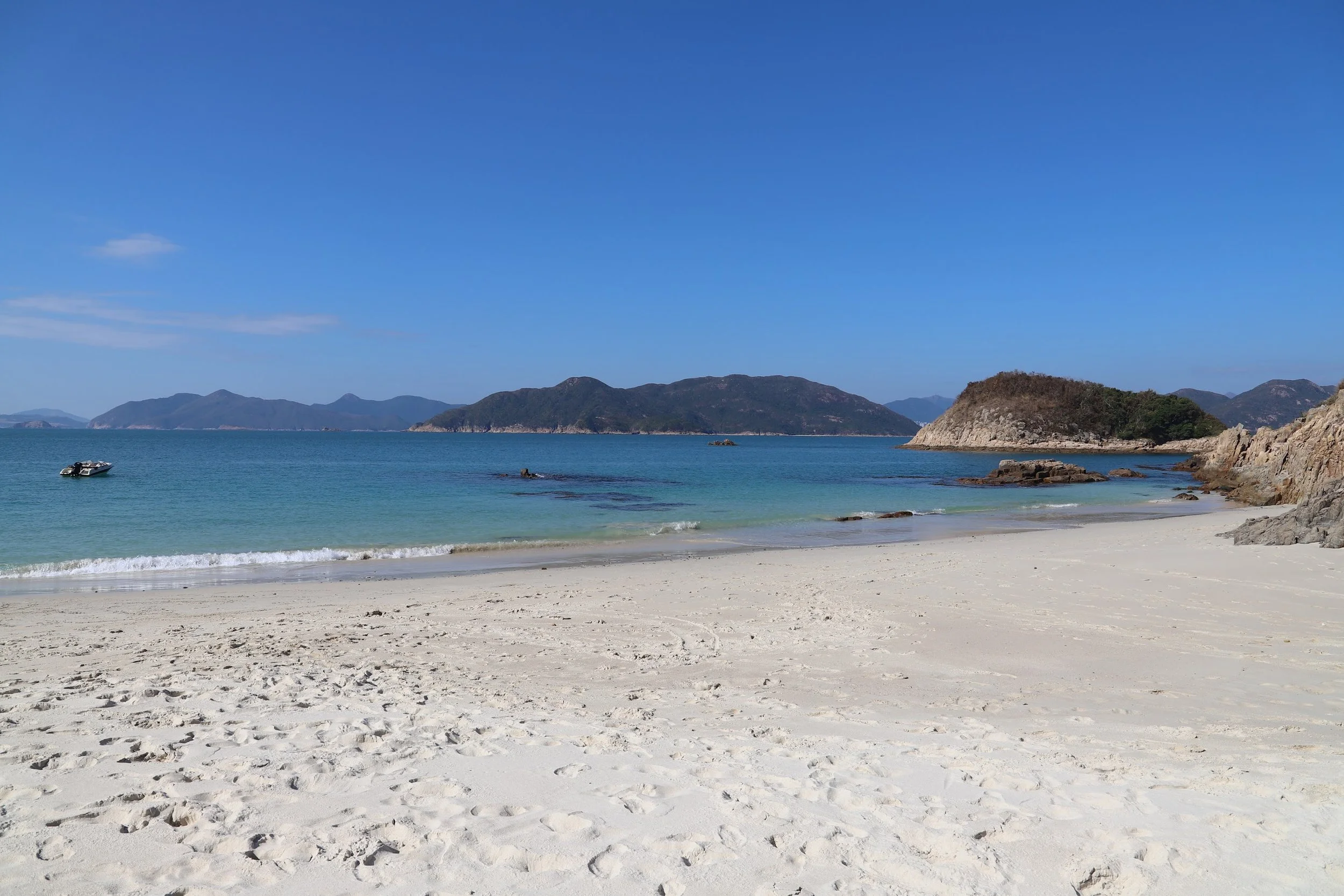 A calm sandy beach and bay on Hong Kong's coast