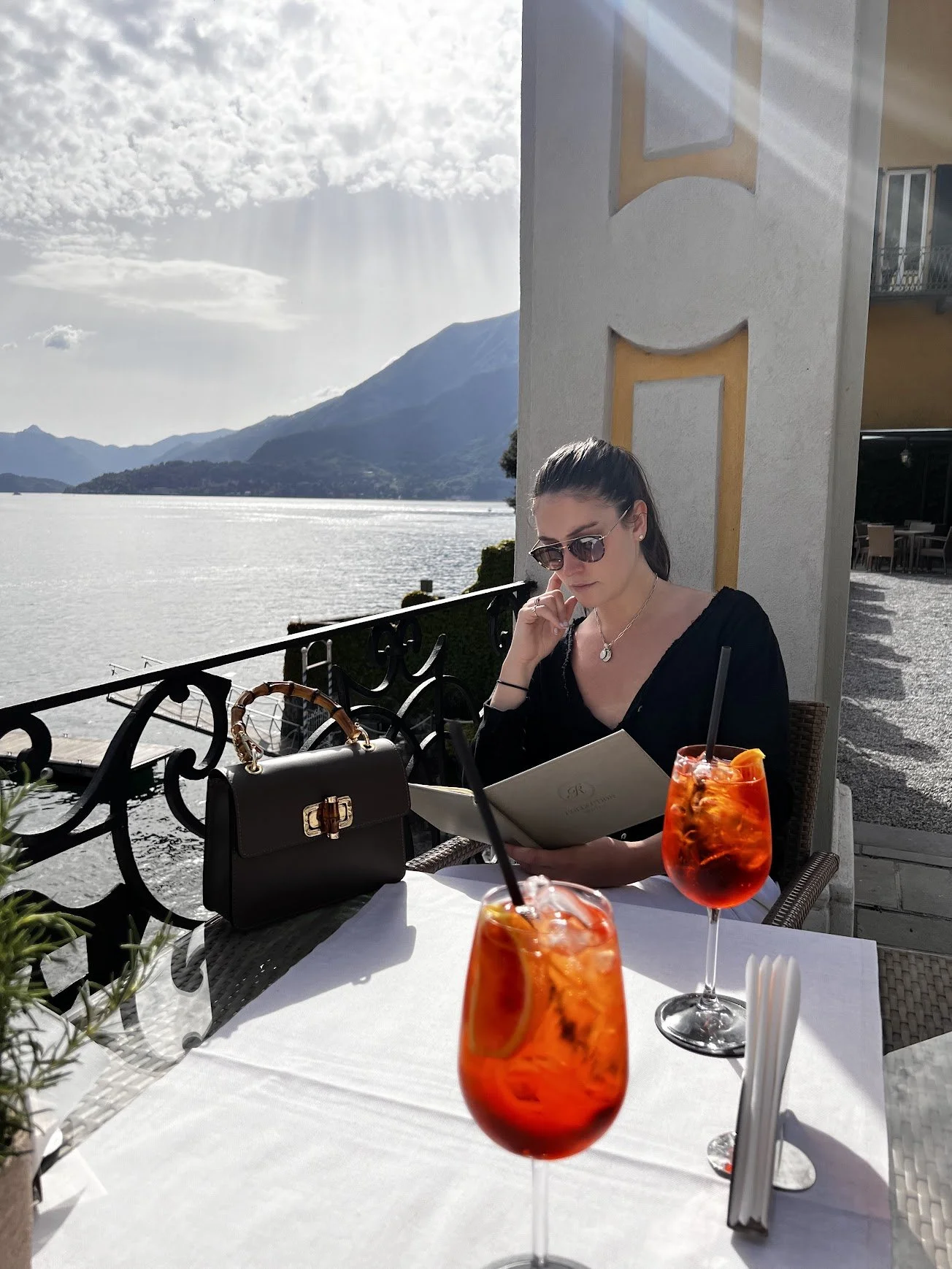 An aperitivo on a balcony overlooking the lake