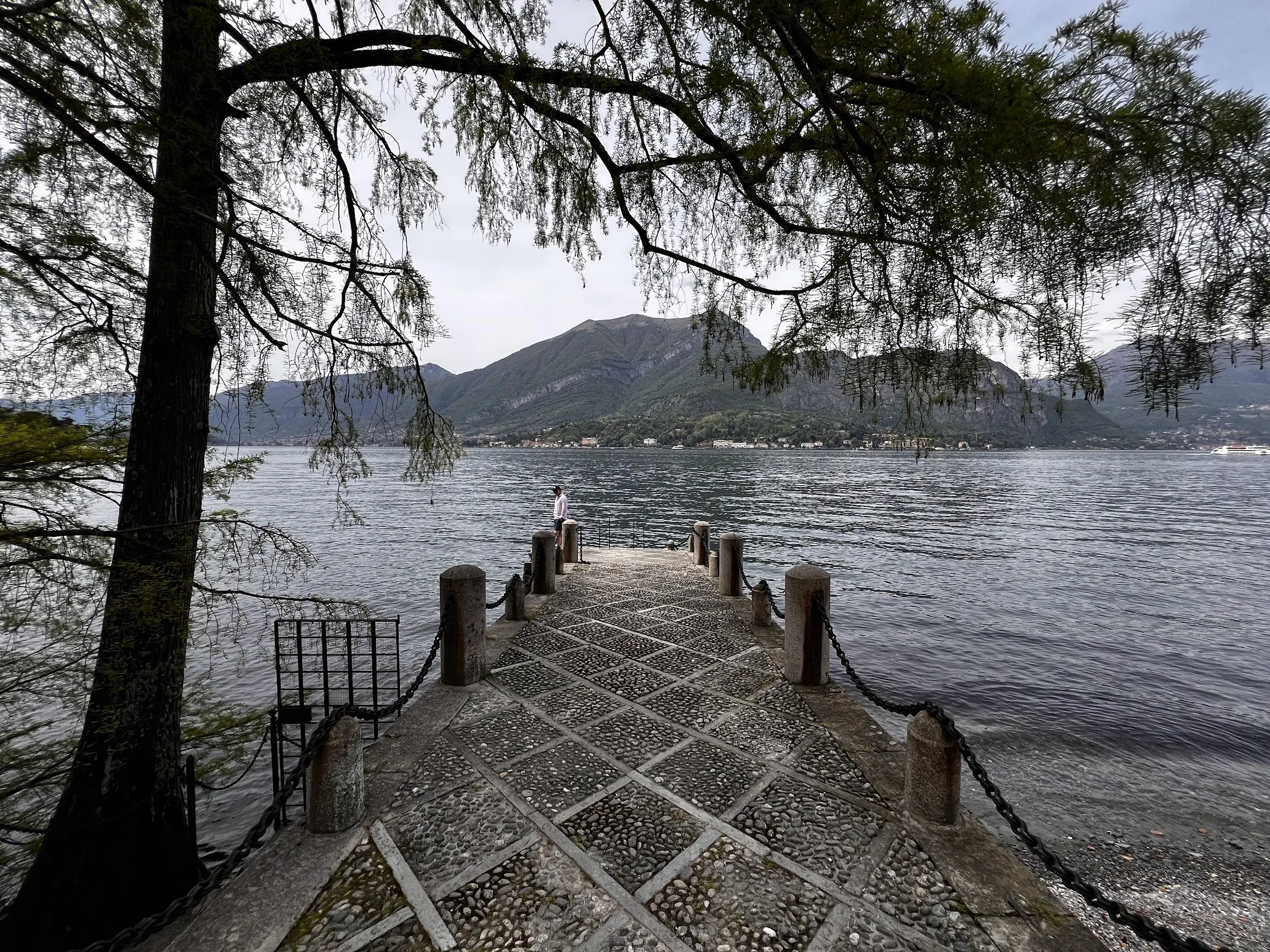 A wooden jetty reaching into the still lake