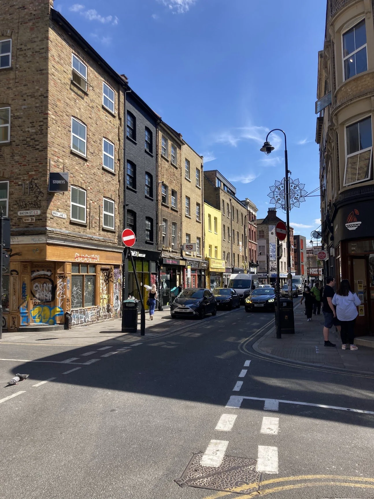 A lively terraced shopping street in London