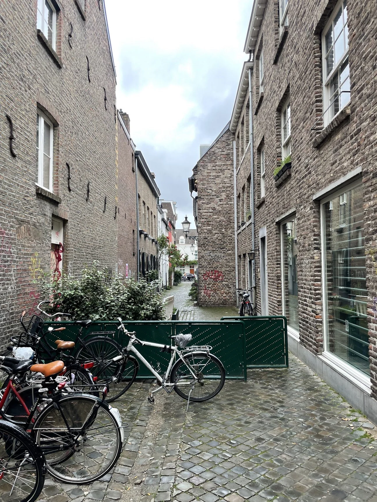 Bicycles parked along a quiet medieval lane