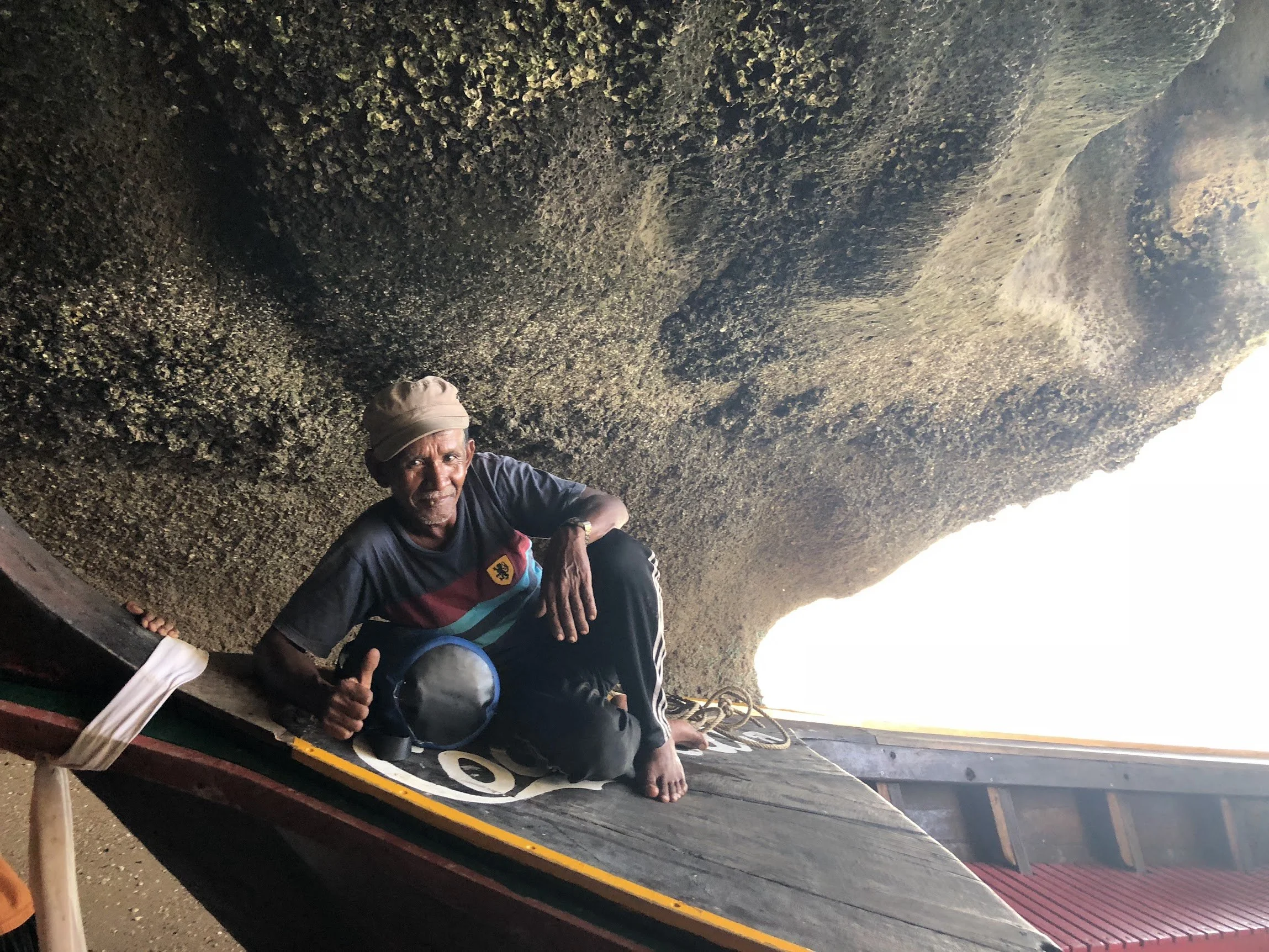 A traveller relaxing on a longtail boat