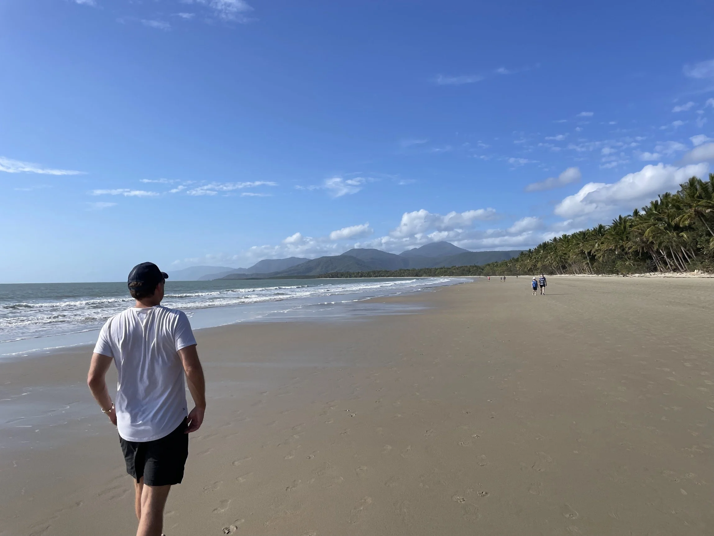 A lone figure looking out across Four Mile Beach