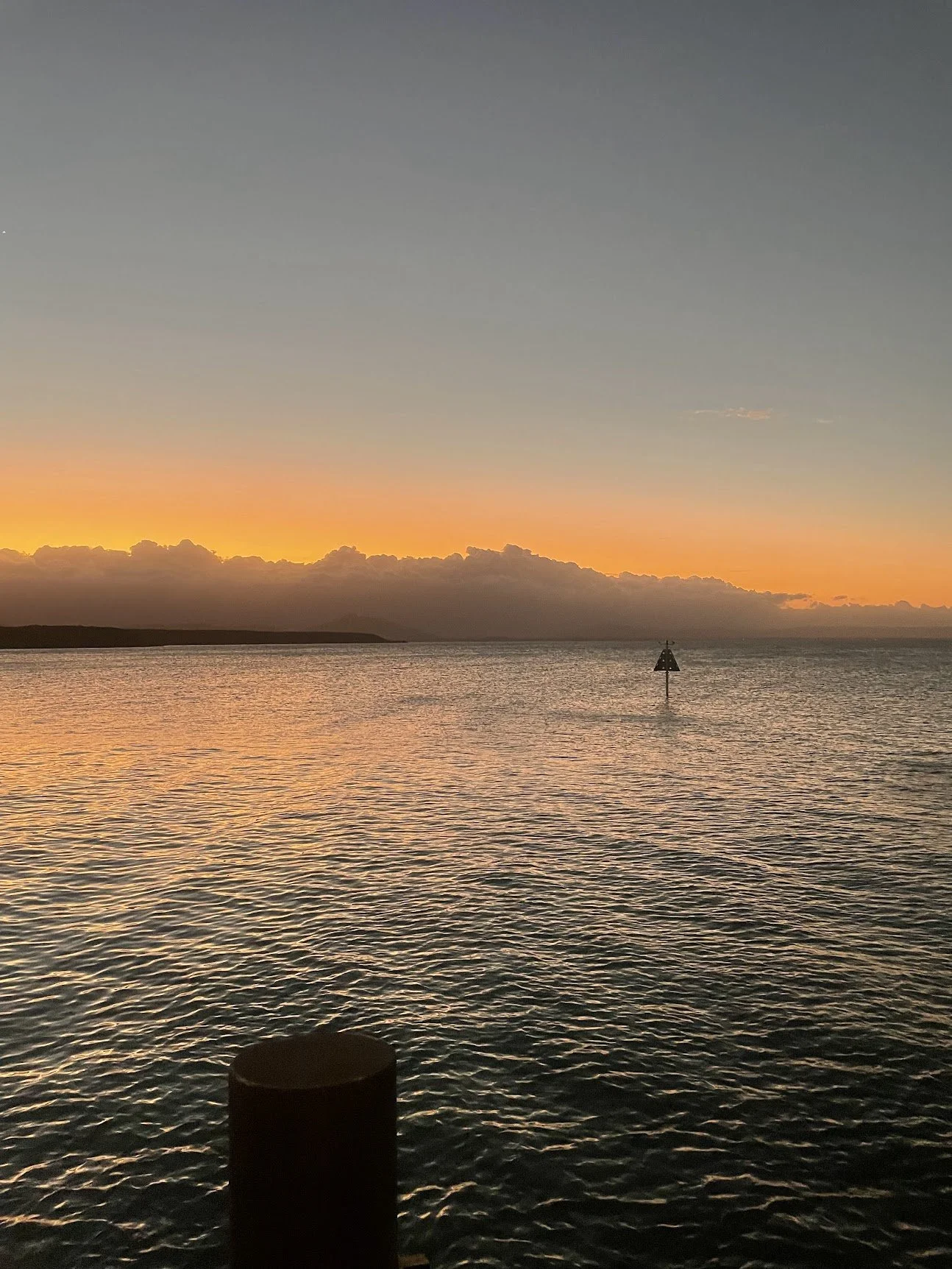 Sunset over the water from a Port Douglas jetty