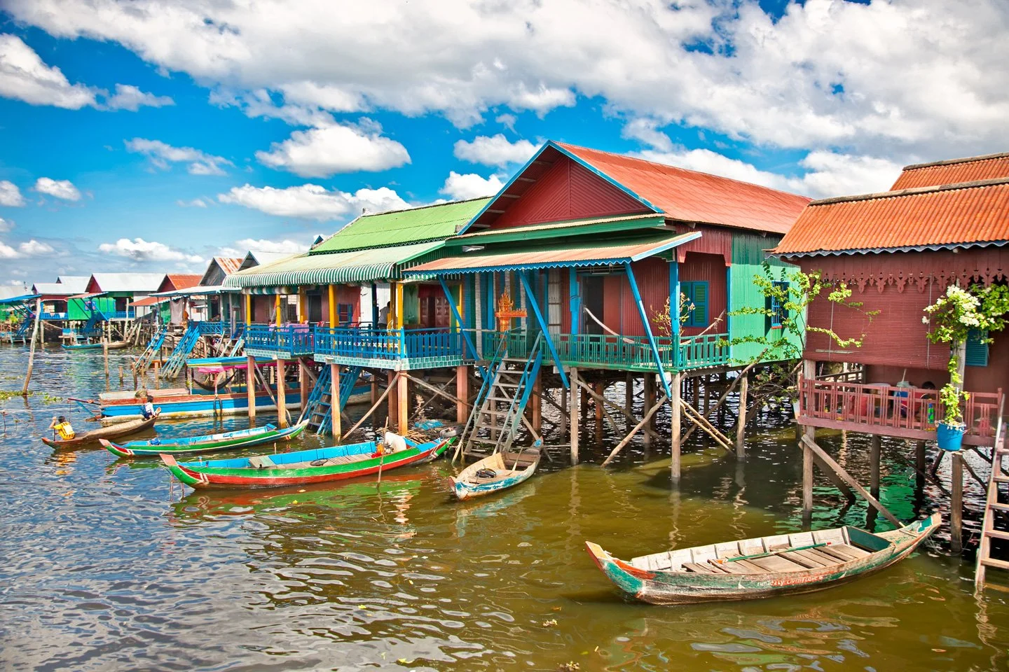 Colourful stilt houses of a floating village on the lake
