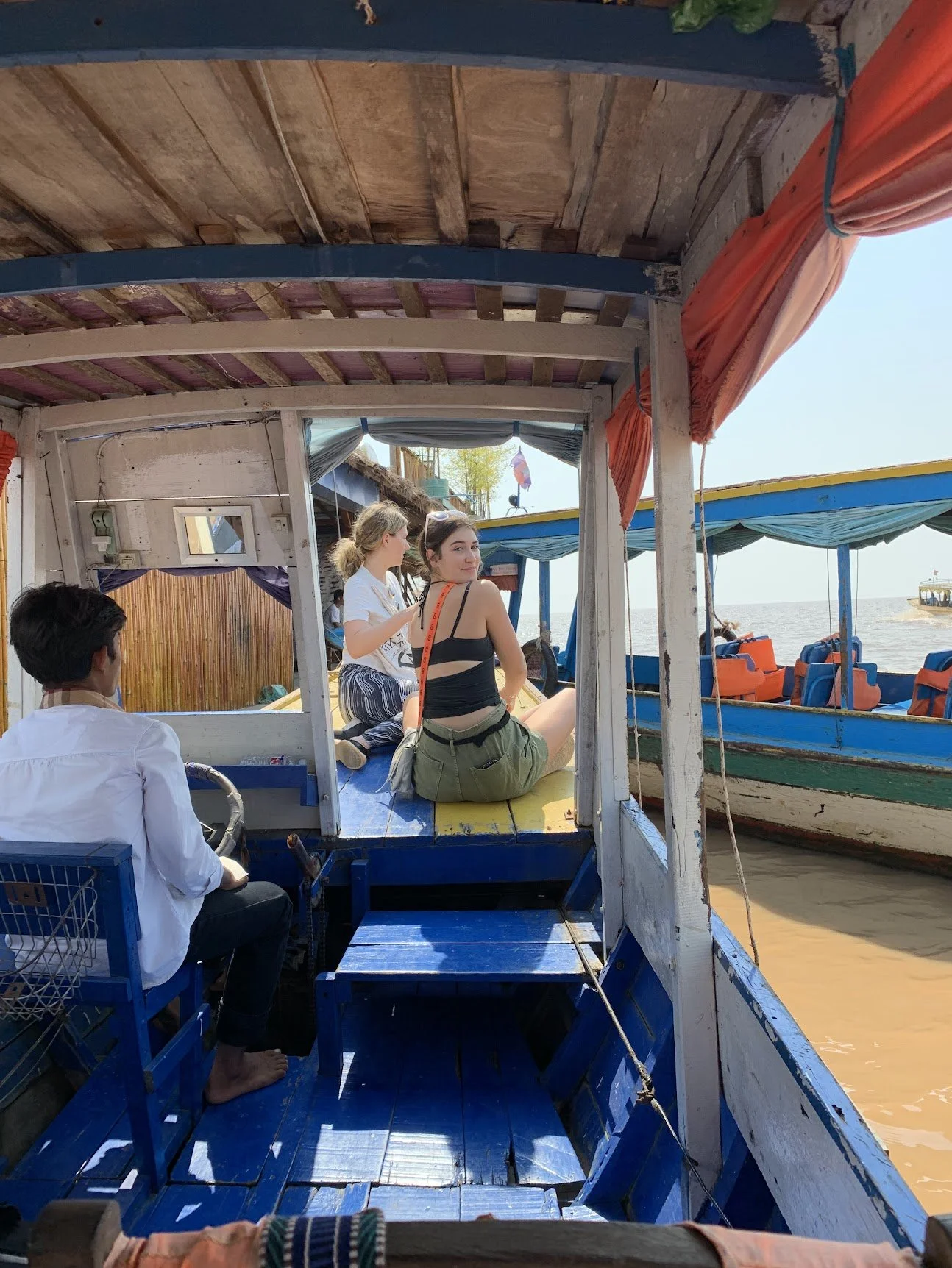 Aboard a boat touring the floating fishing village
