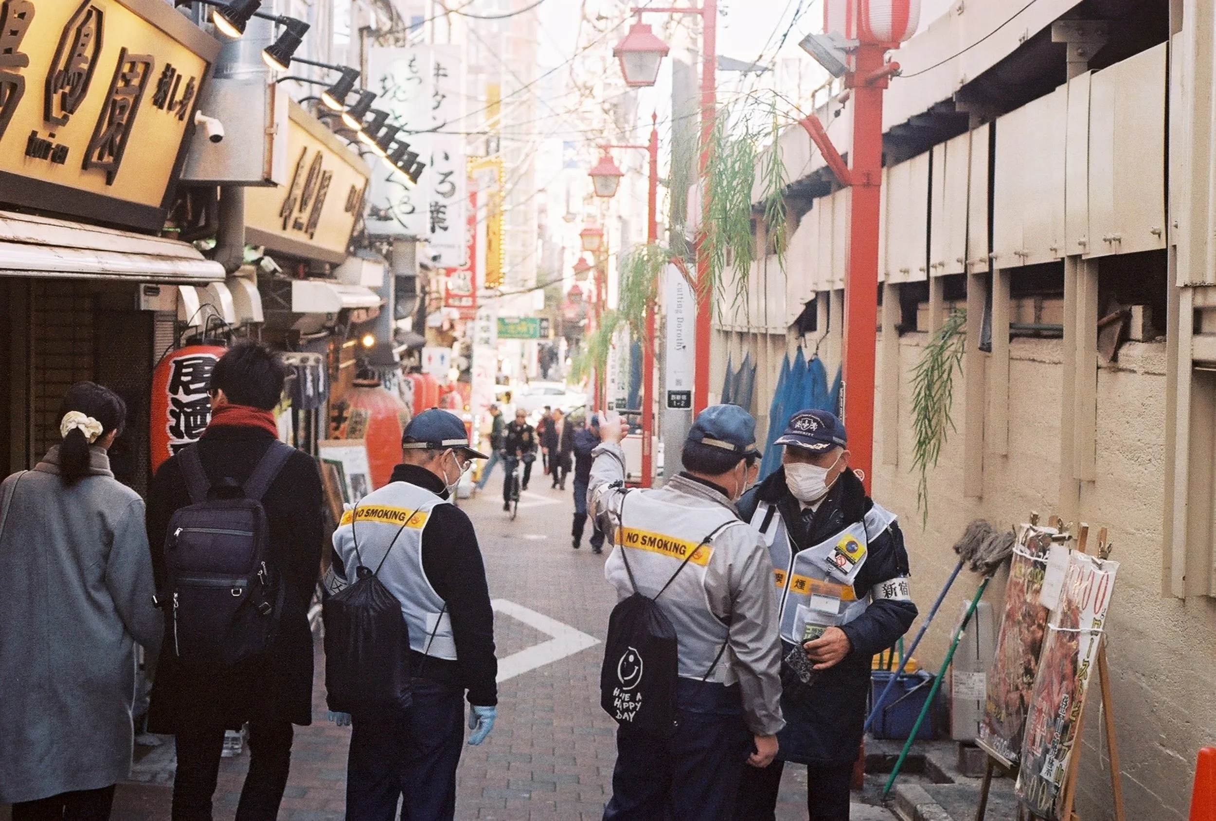 A narrow lantern-lit alley of tiny eateries