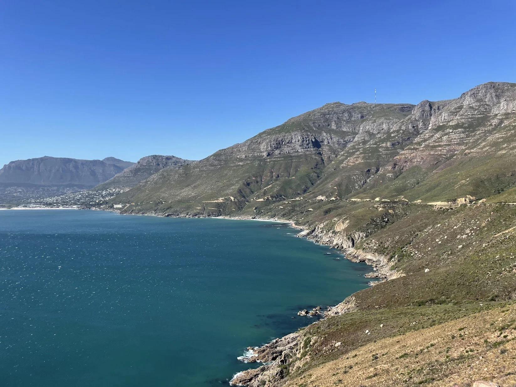 A sweeping bay backed by mountains on the Cape coast